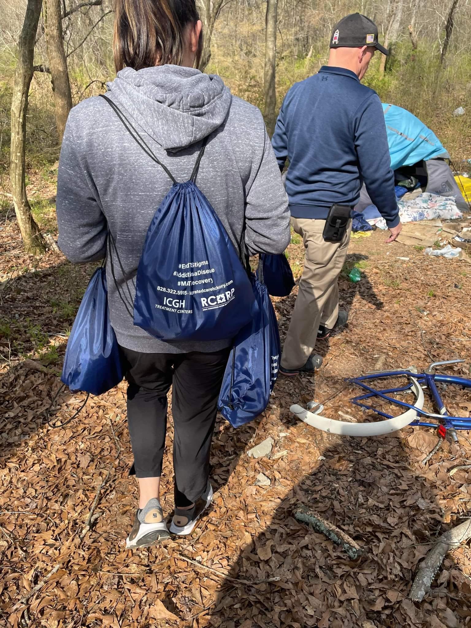 People walking along a wooded trail
